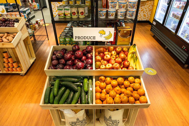 shelf of oranges apples and bananas